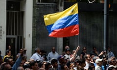 A crowd of opposition supporters listen to Venezuela's National Assembly head