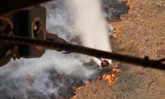 A helicopter drops water on Maui’s wildfires last week