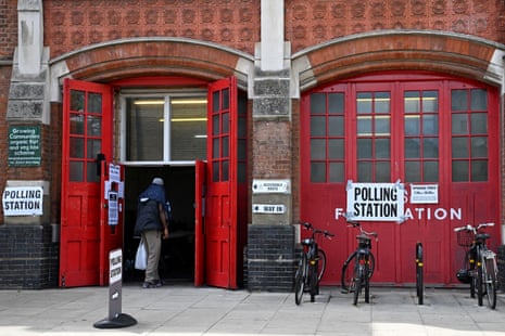 A voter enters a polling station at the Old Fire Station in Hackney, east London, on Thursday.