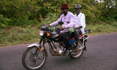 Two men ride a motorbike through rural Guinea-Bissau, near the border with Senegal.