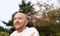 Head and shoulders shot of David Holmes, who was Daniel Radcliffe's stunt double on the Harry Potter films until an accident paralysed him, against a background of autumn trees