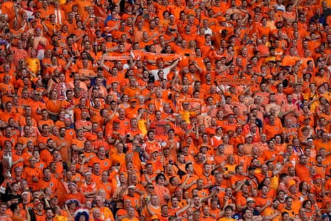Netherlands’ supporters sing along with their national anthem before kick-off.