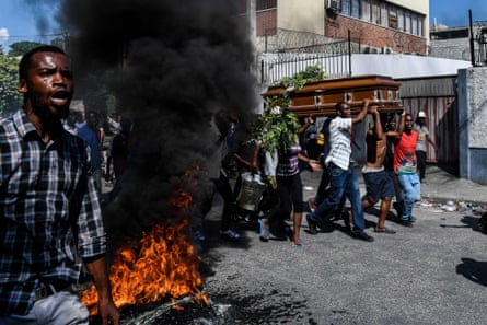 People carry a coffin to a funeral organised by the opposition in Port-au-Prince in October 2019 after weeks of anti-corruption protests demanding Moïse’s resignation.