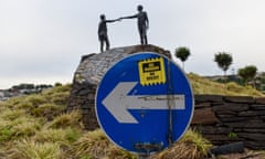 Brexit Is Already Changing Daily Life on Ireland’s U.K. Border<br>A sticker reading “No Border, No Brexit” sits on a road sign near the ‘Hands Across The Divide’ sculpture in Derry, Northern Ireland on Sunday, July 22, 2018. How to keep the Irish border open after the U.K. leaves the European Union has become the trickiest issue in Brexit negotiations. Photographer: Mary Turner/Bloomberg via Getty Images