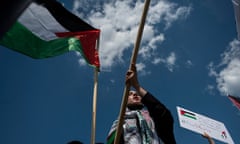 TOPSHOT-US-ISRAEL-PALESTINIANS-CONFLICT-PROTEST<br>TOPSHOT - Activists and protesters march in support of Palestine near the Washington monument in Washington, DC on May 15, 2021. - US President Joe Biden, in a phone call with Israeli Prime Minister Benjamin Netanyahu, expressed his “grave concern” Saturday over the flareup of violence in Israel and Gaza, the White House announced. (Photo by ANDREW CABALLERO-REYNOLDS / AFP) (Photo by ANDREW CABALLERO-REYNOLDS/AFP via Getty Images)