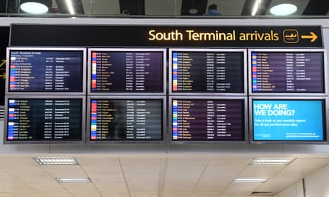 A screen displays information on flight disruption at Gatwick airport