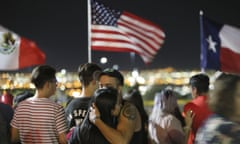 People visit the memorial outside Walmart in El Paso, Texas, where a mass shooting took place on Saturday, Monday, Aug. 5, 2019. (Mark Lambie/The El Paso Times via AP)