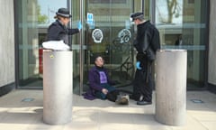 Police speak with an Extinction Rebellion activist, Monday 15 April 2019.