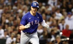 Texas Rangers catcher Mitch Garver (18) reacts after hitting a RBI single against the Arizona Diamondbacks during the seventh inning of Game 5.