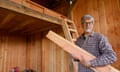 Jess Christman holding a piece of plank of wood