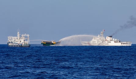 Chinese Coast Guard vessels fire water cannon towards a Philippine resupply vessel in May 2024 on its way to Second Thomas Shoal.