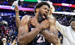 Joel Embiid is doused with water by teammates after scoring 70 points in the 76ers’ victory over the Spurs