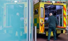 An ambulance with its rear doors open at a hospital