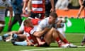 Exeter Chiefs back row Jacques Vermeulen manages to get the ball down despite the best efforts of Gloucester centre Chris Harris.