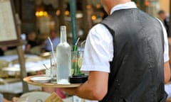 French waiter serving at cafe in Aix en Provence, France - August 4, 2013