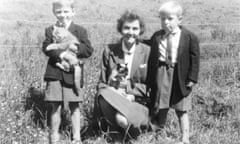 Allan Jenkins (on the right), aged four, with his mum and her Siamese cat, and his brother Christopher, aged five.