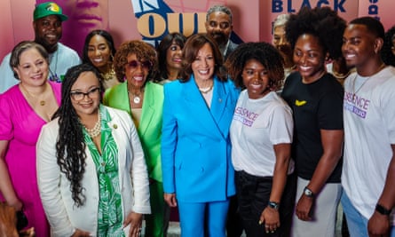 Harris with Democratic representative Maxine Waters (centre left, green jacket) and others at the New Orleans festival on Saturday