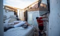 A contractor surveys a home for structural damage