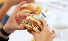 Journalists taste test the plant based hamburgers during a media tour of Impossible Foods labs and processing plant in Redwood City, California, U.S. October 6, 2016. Picture taken October 6, 2016. REUTERS/Beck Diefenbach