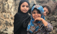 Displaced children wait at a UNHCR emergency aid distribution point in Yemen’s Utmah district
