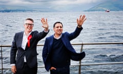 From left, local candidate Martin McCluskey and Scottish Labour leader Anas Sarwar wave to voters while on the Inverclyde coast