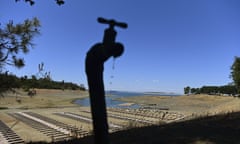Water drips from a faucet near boat docks sitting on dry land at the Browns Ravine Cove area of drought-stricken Folsom Lake, California