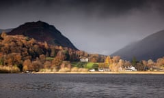 Allan Bank at Grasmere in sunshine under dark skies and Helm Crag, Lake District, Cumbria<br>DJC3R6 Allan Bank at Grasmere in sunshine under dark skies and Helm Crag, Lake District, Cumbria