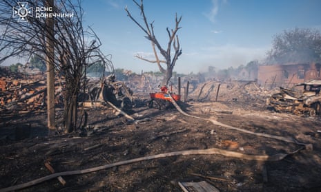 Ukrainian firefighters with Magirus Wolf C1 tactical robot carry out extinguishing efforts at the site of Russian aerial attack on the private residential area of the city of Oleksievo-Druzhkivka, Ukraine on May 28, 2024.