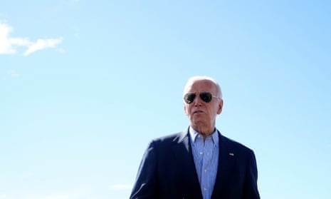 Man in suit and blue shirt and sunglasses