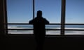 Mohammed Saleh from Gaza looks out from North Steyne Surf Life Saving Club on Manly Beach after arriving from Gaza with his family this week. Wednesday 10th July 2024. Photograph by Mike Bowers. Guardian Australia