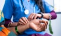 Close up shot of doctor counting pulse by holding hand of sick patient.