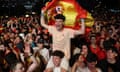 Spain fans celebrate after the final whistle at the Plaza de Cibeles in Madrid.