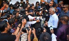 Maldives' President Mohamed Muizzu addresses the media after casting his ballot during the country's parliamentary elections.