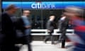 People walk past a Citibank branch on Avenue of the Americas, in New York.