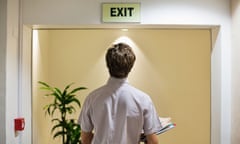 Man exiting a building