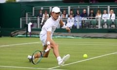 Alex De Minaur of Australia stretches to play a forehand against James Duckworth