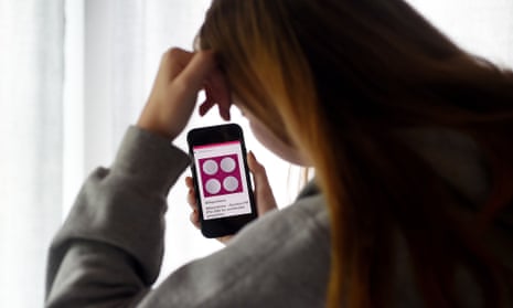 A woman looking at information about abortion pills