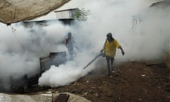 A Sri Lankan worker fumigates buildings to control mosquitoes in Colombo.