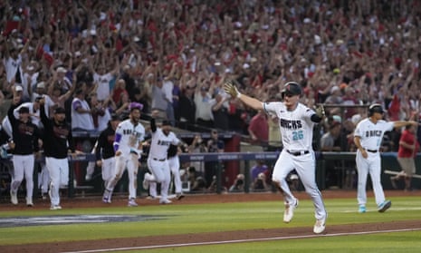 The Diamondbacks’ Pavin Smith scores the winning run after Ketel Marte’s walk-off single in Game 3 of the NLCS against the Phillies on Thursday.