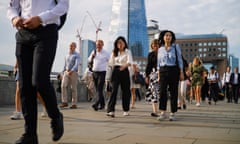 Commuters cross London Bridge on their way to work at the City of London on 12 August. The Bank of England is looking at labour market data to determine the strength of inflationary forces lingering in the&nbsp;economy. 