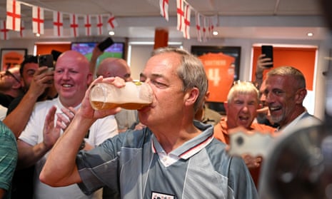 Reform UK leader Nigel Farage wears a 1996 England football shirt and drinks beer as he joins England football fans watching a live broadcast of the UEFA Euro 2024 Group C match between Denmark and England at The Armfield Club in Blackpool, northwestern England, on 20 June 2024.