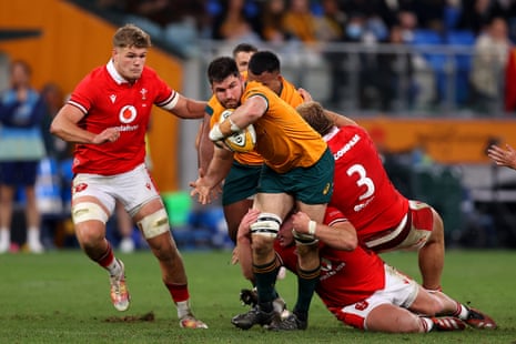 Liam Wright of the Wallabies is tackled.