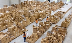 factory workers surrounded by boxes