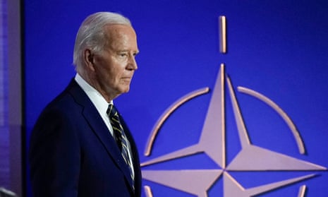 President Joe Biden walks during an event commemorating the 75th anniversary of Nato on 9 July.