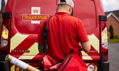 Back view of postal worker near a Royal Mail van