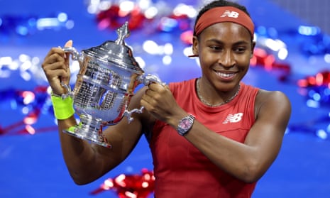 Coco Gauff celebrates with the US Open trophy