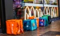 Just Eat, Deliveroo and other delivery rider bags outside a McDonald’s in Ilford.