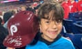 Hayden Dorfman, 10, of Voorhees, New Jersey, holds up Philadelphia Phillies slugger Bryce Harper’s autographed helmet during a baseball game against the Pittsburgh Pirates on Thursday. Harper tossed his helmet into the stands after he was ejected and it was retrieved by Dorfman