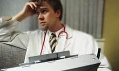 A stressed-looking doctor in a hospital.