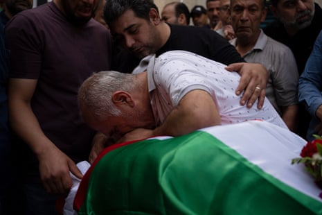 Palestinians mourns over the body of the doctor Ossayed Kamal Jabareen, in the West Bank city of Jenin on Thursday.